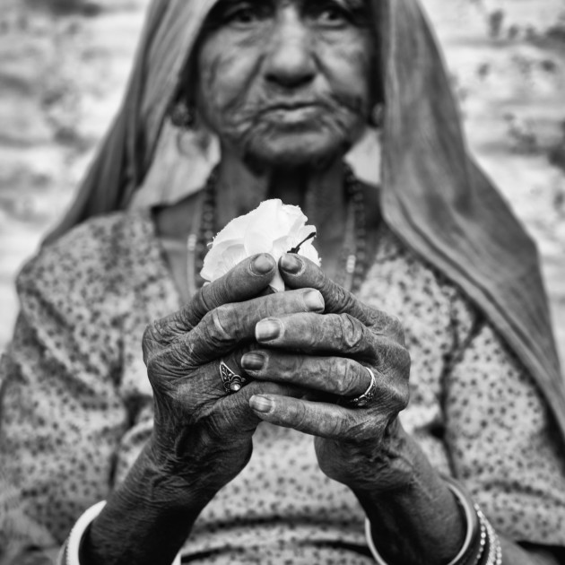 Gandhi&rsquo;s Threads. Spinning and weaving the Khadi cloth, her hands told the story of a lifetime. Woven from cotton, hemp, silk and wool. They were the threads for Gandhi to promote the ideology of India&rsquo;s self reliance. I photographed Bali in the village of Karno in Nagur, India in 2013. Locals gathered wondering why I was so interested in Bali with her delicate, agile fingers spending all her days leaning against the same wall spinning Khadi cloth. I sensed her hands represented a legend.